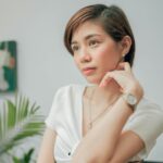 woman-in-white-button-up-shirt-sitting-on-chair-n56oc3fpdsa